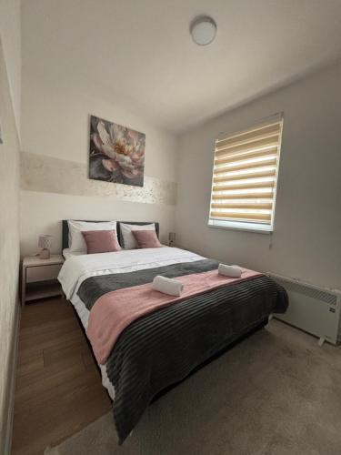 Una cama o camas en una habitación de Apartman Milan