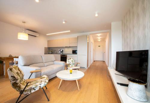 Μια τηλεόραση ή/και κέντρο ψυχαγωγίας στο Villa Ladini - apartment Olea