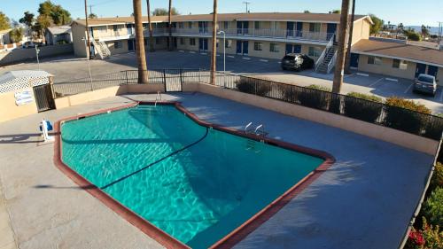 an overhead view of a swimming pool in a parking lot at Rodeway Inn & Suites Blythe I-10 in Blythe