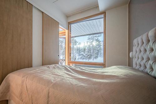 Katil atau katil-katil dalam bilik di Frost Chalet by Aavalevi Holidays, Ski-in Ski-out, Mountain view