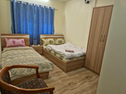 A bed or beds in a room at Ashmit' Manor