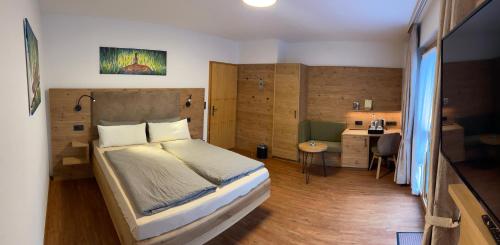 Letto o letti in una camera di Hotel und Berggasthof Zum Sonnenhof