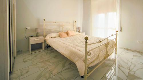 Ένα ή περισσότερα κρεβάτια σε δωμάτιο στο Via Roma a Castelsardo