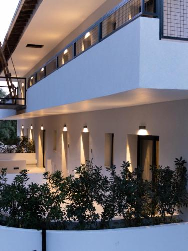 an external view of a building with trees at Aella Exclusive Residences Lefkada in Mikros Gialos