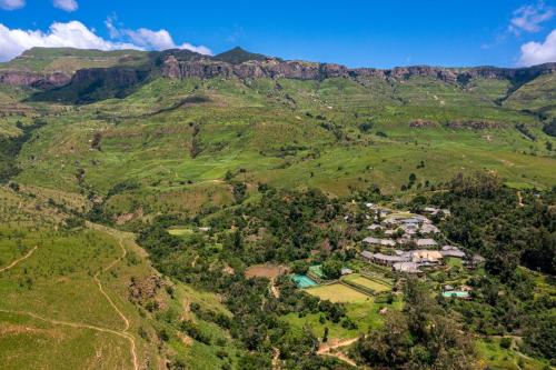 an aerial view of a village in the mountains at Cavern Resort & Spa in Bergville