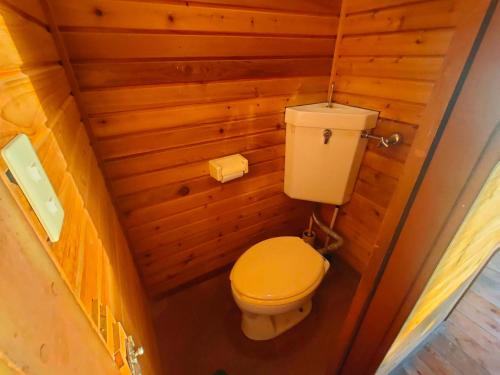 an overhead view of a toilet in a wooden bathroom at 南伊豆ランドホピア Minami Izu Land Hopia in Minamiizu