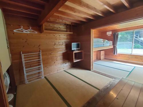 Giường trong phòng chung tại 堂ヶ島ランドホピア Dogashima Land Hopia