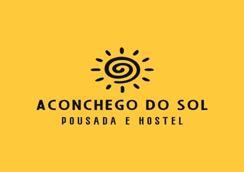 a yellow sign with a sun on a yellow background at Pousada - Aconchego do Sol in João Pessoa