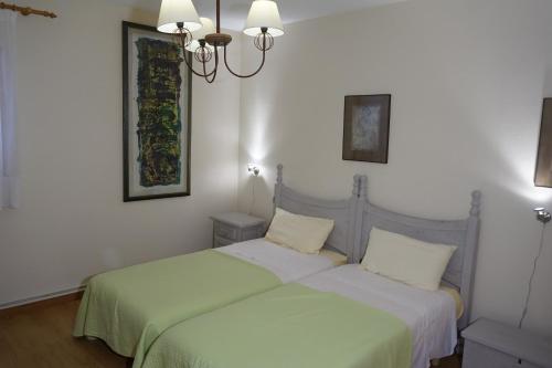 A bed or beds in a room at Casa la Paloma