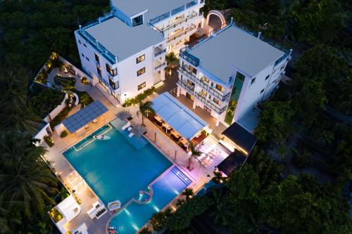 an overhead view of a building with a swimming pool at Sanya Haishi Swimming Pool Design Hotel in Sanya