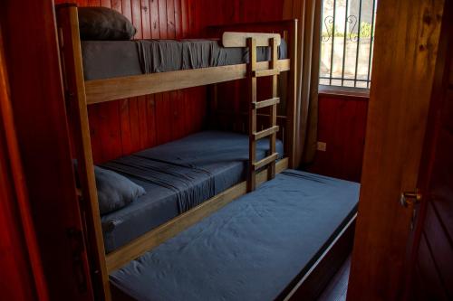 Postel nebo postele na pokoji v ubytování Cabaña Lanèr