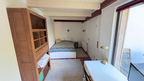 Postel nebo postele na pokoji v ubytování Little Cottage Merbeck