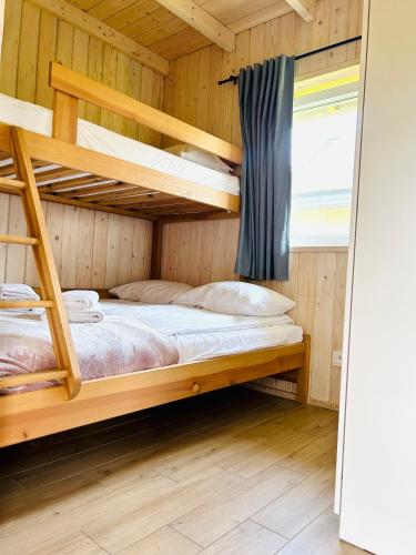 Postel nebo postele na pokoji v ubytování Osada Chmiel