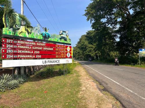 a sign on the side of a road at Blu Marine Nilaveli in Trincomalee