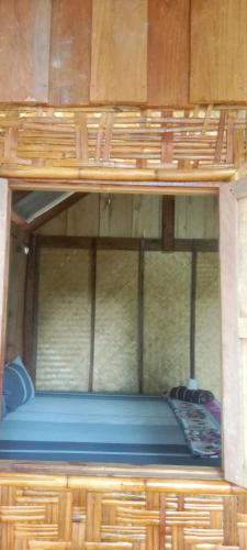 a bunk bed in a room with a blue mattress at Som PalmGarden in Ko Lanta