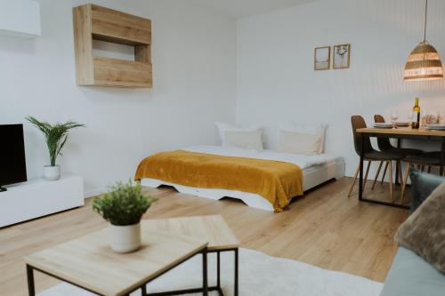 a bedroom with a bed and a living room at Moderne Wohnung in Dernbach WW in Dernbach