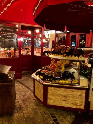 a display of food on a table in a store at Trouville Palace Le Bonheur in Trouville-sur-Mer