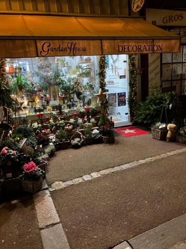 a flower shop with flowers and plants in it at Trouville Palace Le Bonheur in Trouville-sur-Mer