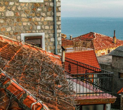 a view of a building with a staircase on a balcony at Villa Dulcinea in Ulcinj