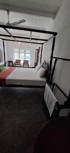 Ένα ή περισσότερα κρεβάτια σε δωμάτιο στο The Galle Arcade