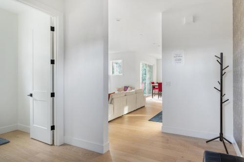 a room with white walls and a living room at Elegant 3-Story House with Private Backyard in WA in Kirkland