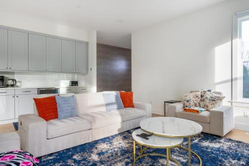 a living room with a couch and a table at Elegant 3-Story House with Private Backyard in WA in Kirkland