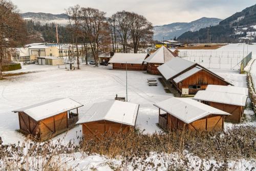 a group of buildings with snow on their roofs at Raddörfl in Teufenbach