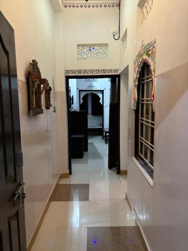 a hallway leading to a room with a door at The Royal Lake View Villa in Udaipur