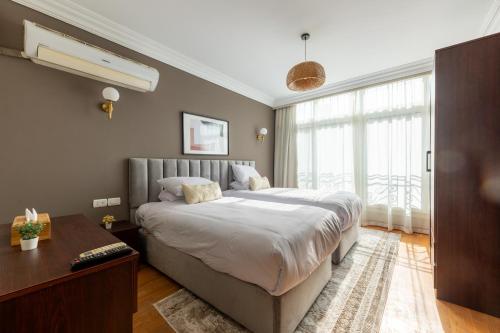 Postel nebo postele na pokoji v ubytování 1842 - 2br Serviced Apartment - Central