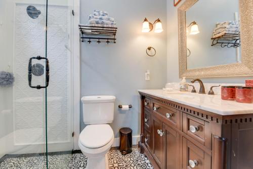 a bathroom with a toilet and a shower at Casa De Cubana in Key West