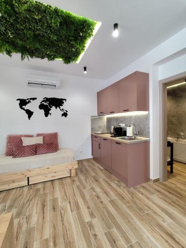a kitchen with a bed in a room at Meteora Gold and Glass Suites in Kalabaka