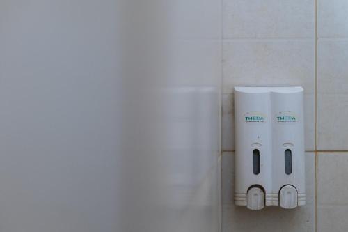a bathroom with two rolls of toilet paper on a wall at A'rabia Style Wahid Hasyim in Medan