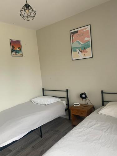Un ou plusieurs lits dans un hébergement de l'établissement Hôtel La Cote d'Argent
