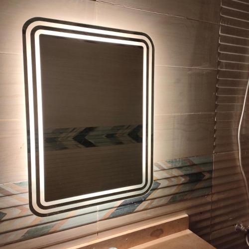 a large mirror on the wall of a bathroom at العاصمة الإدارية in Cairo