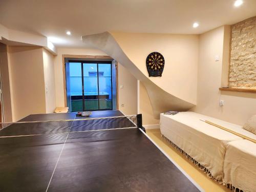 a bedroom with a bed and a staircase in a room at Villa Alekatele à 80m de la plage in La Tranche-sur-Mer