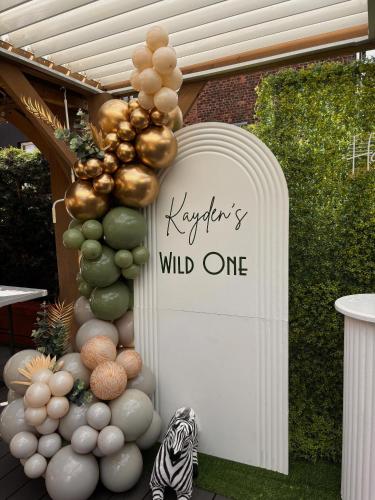 a sign for a wild one event with balloons at Hendham House in Manchester