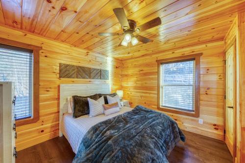a bedroom with a bed and a ceiling fan at WOW, that View! NEW Luxury Cabin - Hot Tub - Pool Access - Game Room in Sevierville