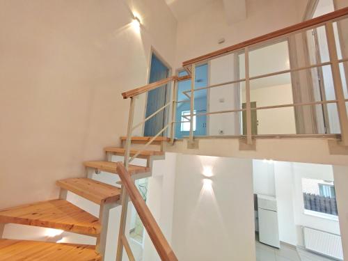 a staircase in a house with a window at Vila Novara V25 in Bordeiu
