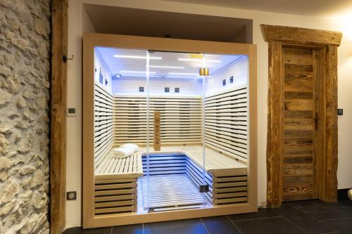 a room with a large closet with wooden doors at Wanderful Life MontBlanc refuge haut de gamme in Saint-Gervais-les-Bains