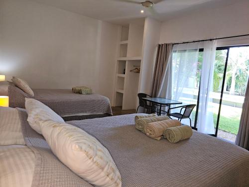 Postel nebo postele na pokoji v ubytování Seahorse Resort Tamarindo