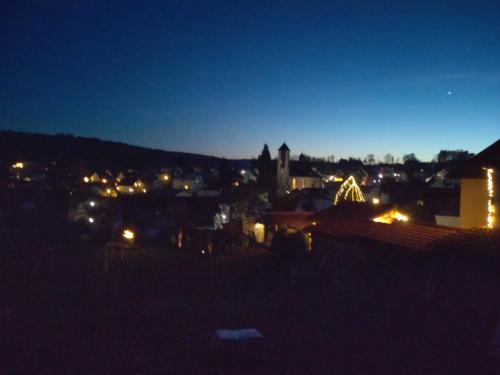a view of a city at night at Gästezimmer M. Schubert in Oberelbert