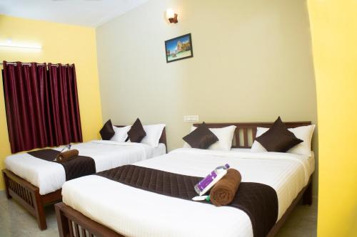 Postel nebo postele na pokoji v ubytování sky suite residency