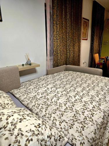 Postel nebo postele na pokoji v ubytování Apartman 77