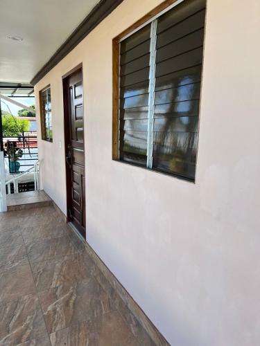 a hallway of a house with a window at Apartment Open House in Managua