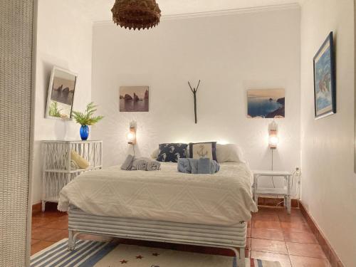 a bedroom with a large bed in a room at Villa Ines, at the beach in Porto Santo
