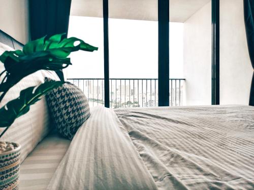 Cama o camas de una habitación en The Landmark by Katana 3BR to 4BR Luxury Seaview Landmark Homestay at Gurney 15-16pax 无敌海景套房
