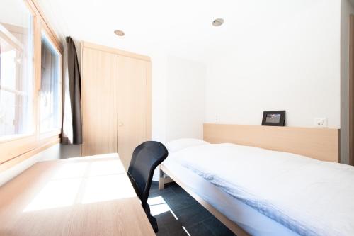 Postel nebo postele na pokoji v ubytování ESCAPE Chalets