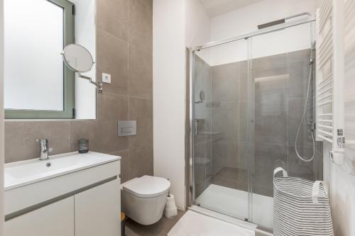 a bathroom with a shower and a toilet and a sink at Douro's Balcony View - Swimming pool in Vila Nova de Gaia