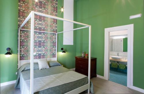 Ένα ή περισσότερα κρεβάτια σε δωμάτιο στο Au Vieux Lavinaio