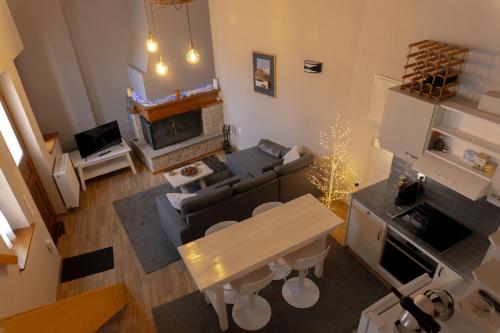 an overhead view of a living room with a fireplace at Alina's House in Arachova